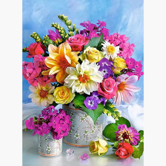 a stunning arrangement of colorful flowers, including roses, dahlias, and petunias, in elegant decorative vases